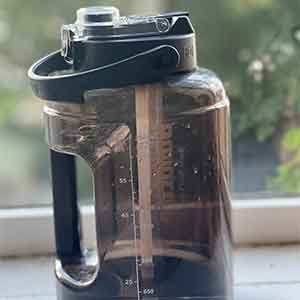 A photo of a dark grey bottle 